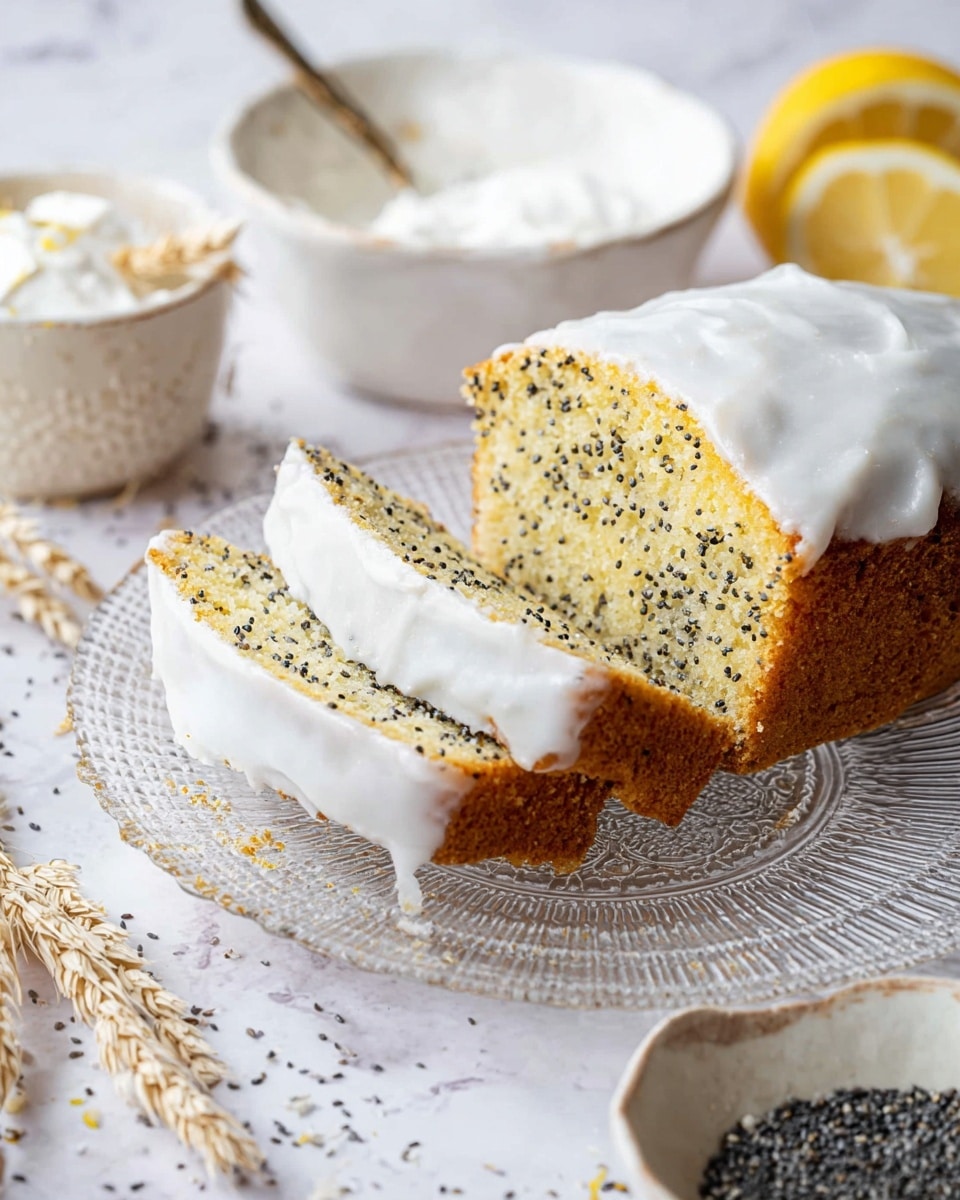 A close-up of a sliced lemon poppy seed cake on a clear glass plate with a detailed pattern. The cake has one thick layer, light yellow with dark poppy seeds scattered inside, topped with a smooth, white icing layer that looks creamy and slightly shiny. In the background, there is a white marbled surface with a white bowl holding some white creamy mixture with a spoon inside and a small white bowl with black poppy seeds. Some lemon slices and dried wheat decorations are also scattered around. photo taken with an iphone --ar 4:5 --v 7