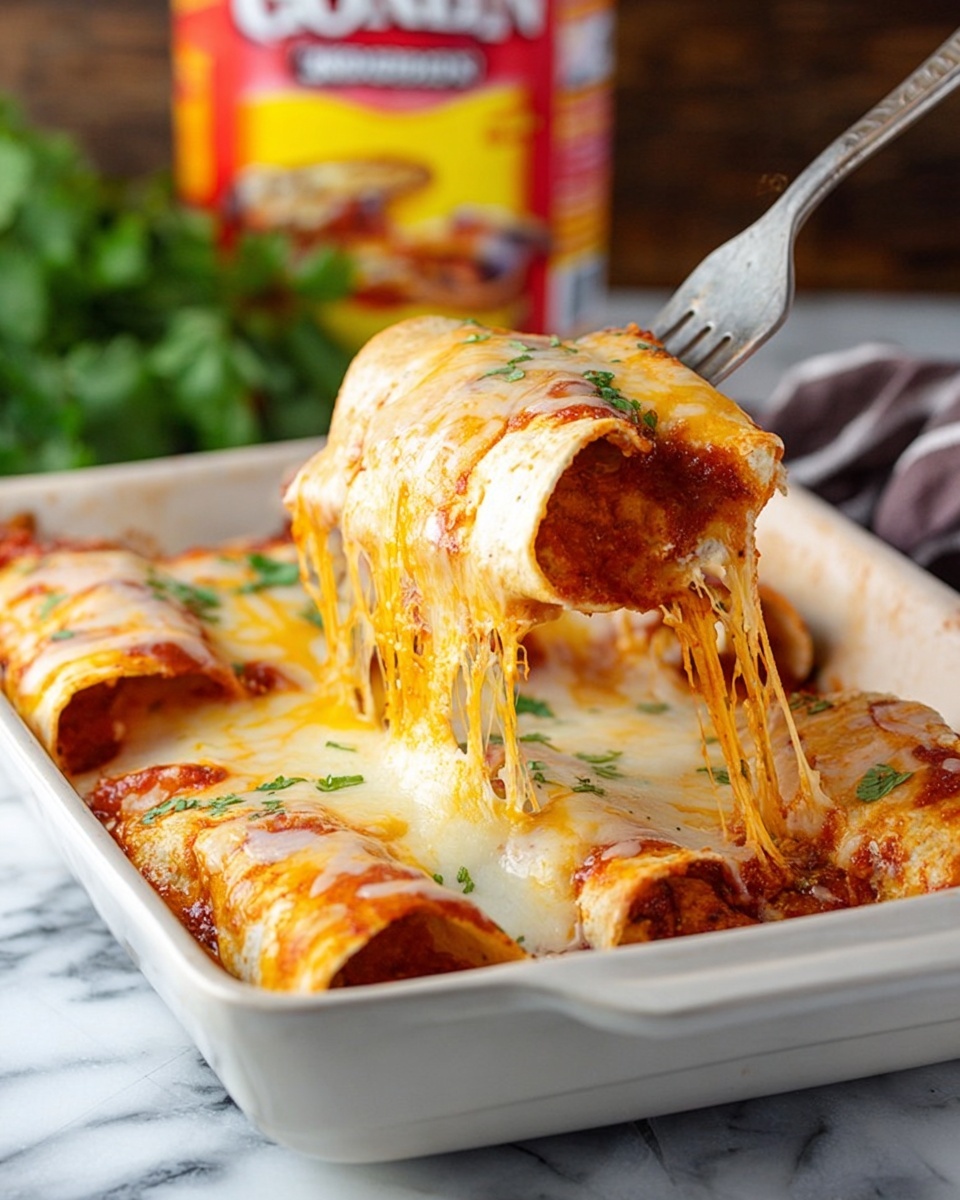 The image shows a white rectangular baking dish filled with two rolled enchiladas covered in melted cheese, lifted by a spoon. The enchilada tortillas are soft and white, with a thick layer of red sauce underneath the golden melted cheese that stretches in strands as one enchilada is lifted. The cheese layer is smooth with a mix of white and light yellow melted cheese, covering the top of the rolled tortillas. The dish sits on a white marbled surface with green herbs blurred in the background, and a colorful thick cut chili sauce packet visible behind. Photo taken with an iphone --ar 4:5 --v 7